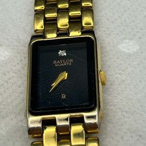 Gold and Black Quartz Watch - 76
